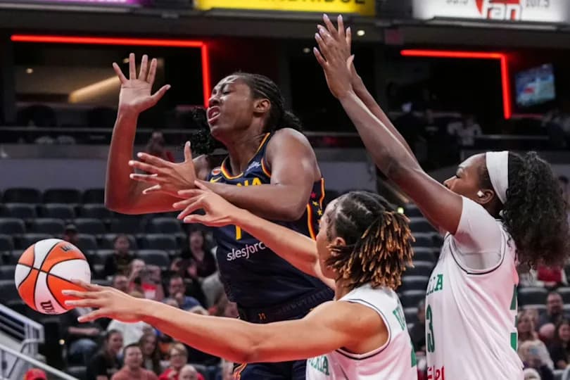 Indiana Fever forward Aliyah Boston (7) loses the ball against Nigeria’s Pallas Kunaiyi (3) and Nigeria’s Nicole Enabosi (33) on Saturday, May 2, 2026, during the first half of a preseason game at Gainbridge Fieldhouse in Indianapolis.